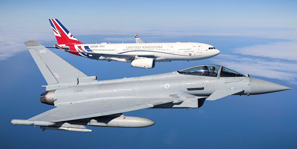 Typhoon fighter aircraft flying with a United Kingdom government aircraft